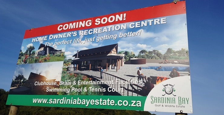 A notice board marks where the new residents' recreation centre – featuring a braai area, swimming pool, tennis court and meeting room – will be built.